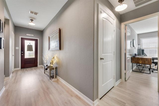 foyer entrance featuring light hardwood / wood-style flooring