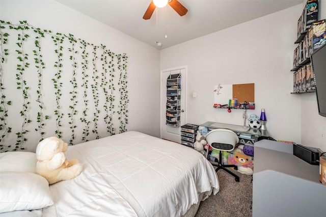 carpeted bedroom featuring ceiling fan and a closet