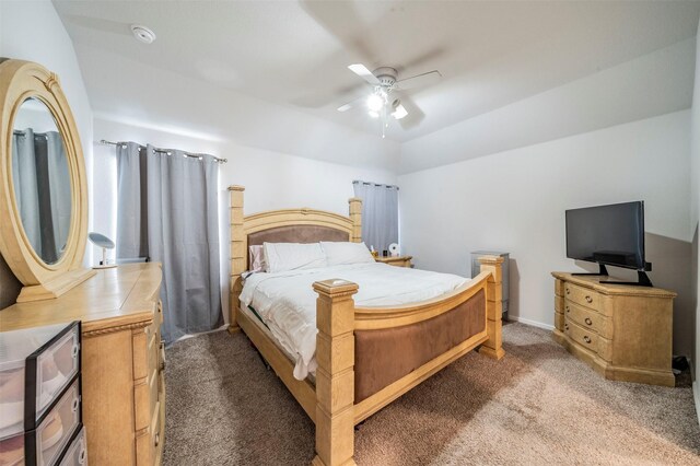 bedroom featuring ceiling fan, lofted ceiling, and carpet flooring