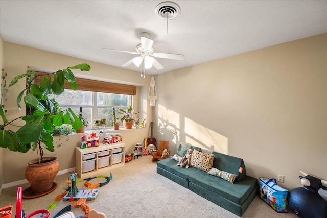 rec room with ceiling fan and carpet flooring