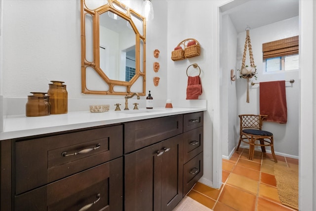 bathroom with tile patterned floors and vanity