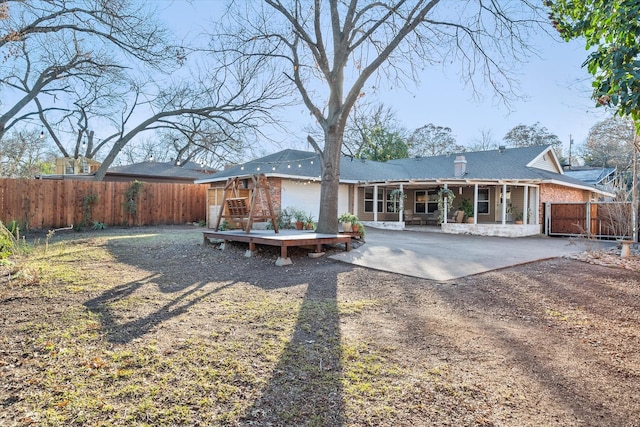 rear view of property featuring a patio area