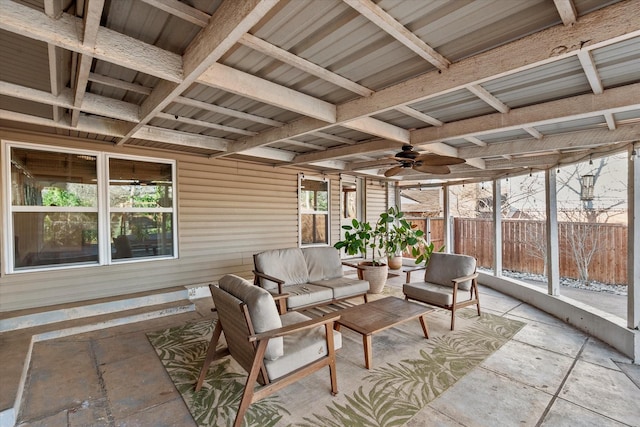 sunroom / solarium with ceiling fan and a healthy amount of sunlight