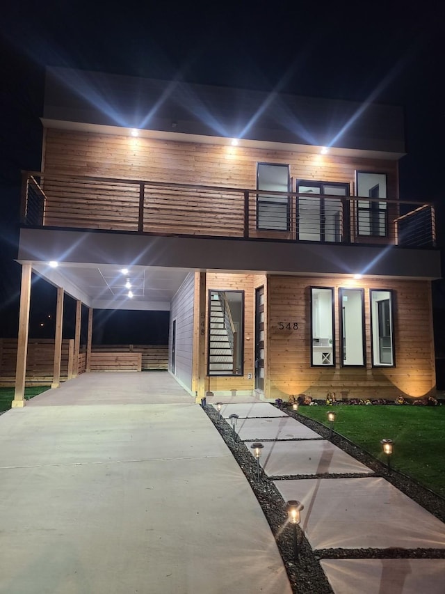 view of front of home with a balcony