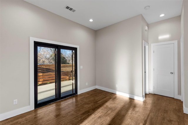 empty room with hardwood / wood-style floors