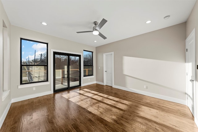 interior space with ceiling fan and wood-type flooring