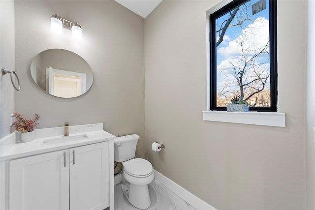 bathroom with toilet and vanity