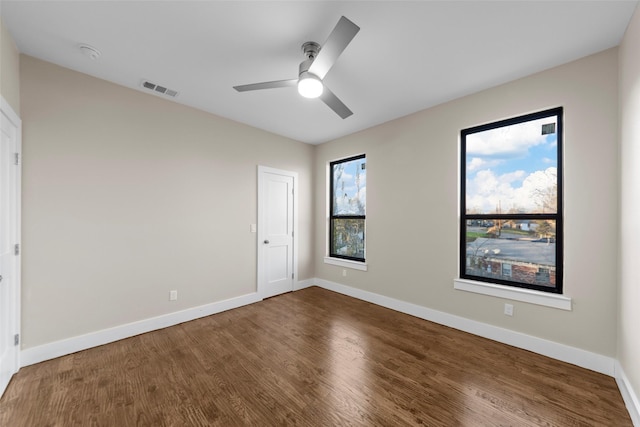 unfurnished bedroom with ceiling fan and wood-type flooring