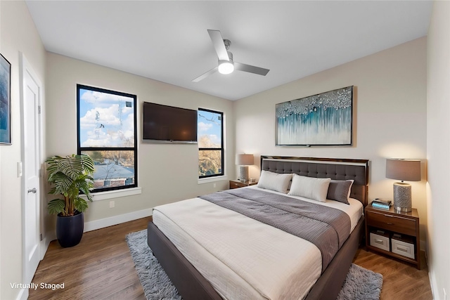 bedroom featuring hardwood / wood-style floors and ceiling fan