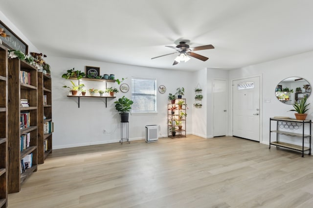 interior space with light wood-type flooring and ceiling fan