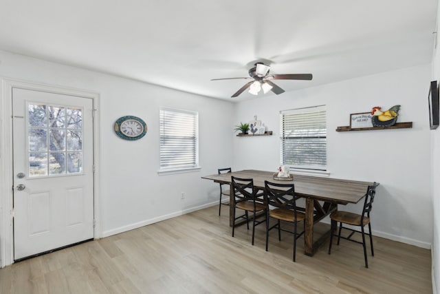 dining area featuring ceiling fan and light hardwood / wood-style flooring