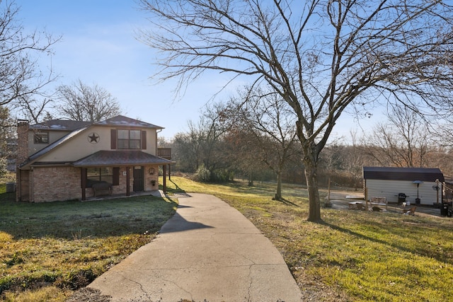 exterior space featuring a porch and a storage shed