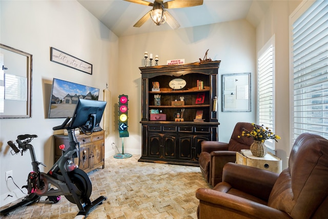 exercise area with vaulted ceiling and ceiling fan