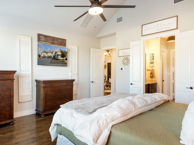 bedroom with lofted ceiling, dark wood-type flooring, connected bathroom, and ceiling fan