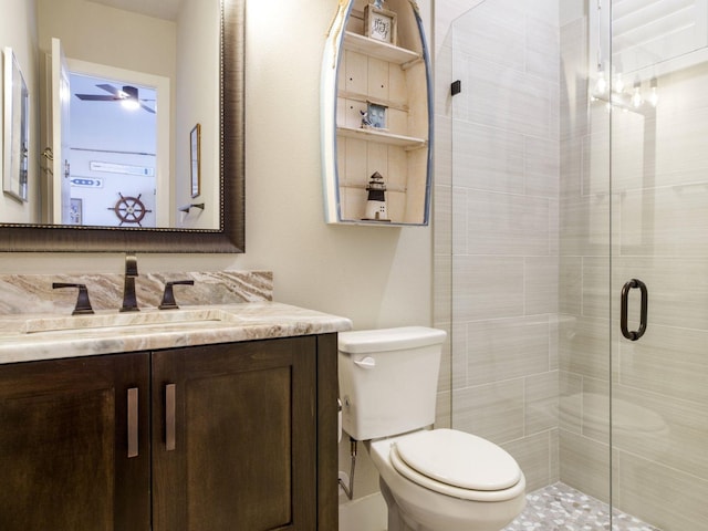 bathroom with vanity, toilet, and walk in shower