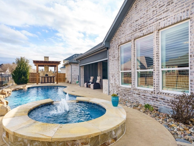 view of pool featuring a patio area, pool water feature, and an in ground hot tub