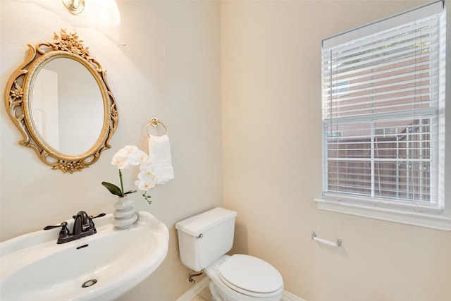 bathroom with toilet and sink