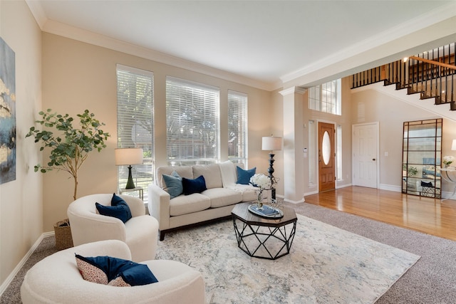 living room featuring ornamental molding and carpet flooring