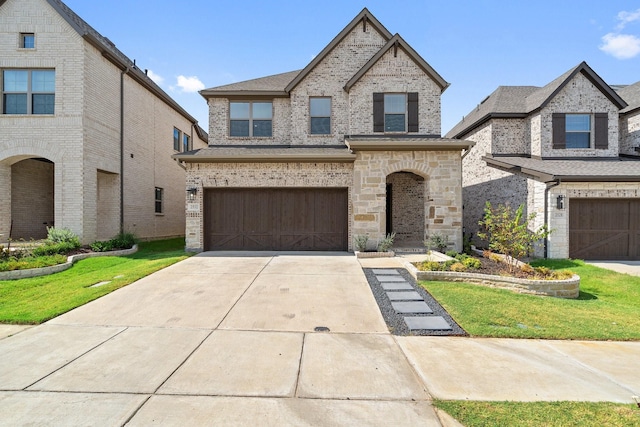 french country inspired facade with a garage and a front lawn