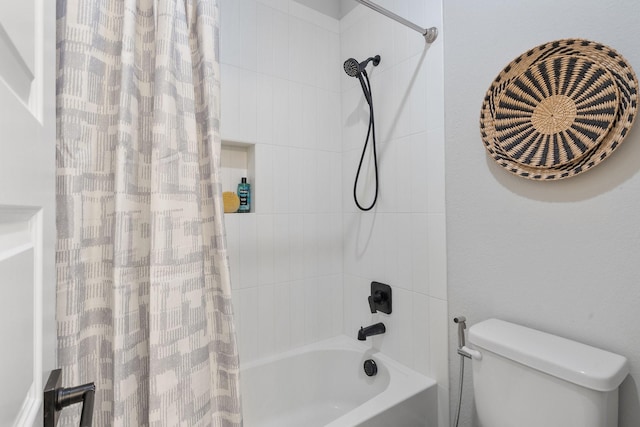 bathroom featuring toilet and shower / tub combo