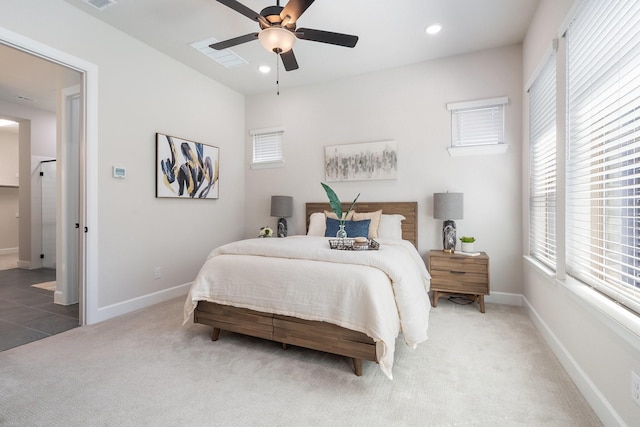 bedroom featuring ceiling fan, carpet flooring, and multiple windows