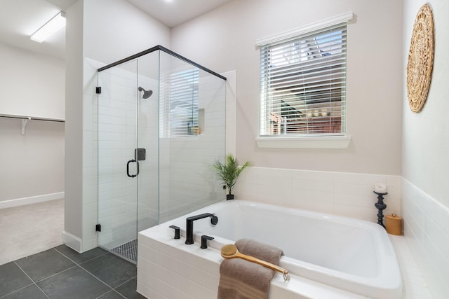 bathroom with tile patterned floors and plus walk in shower