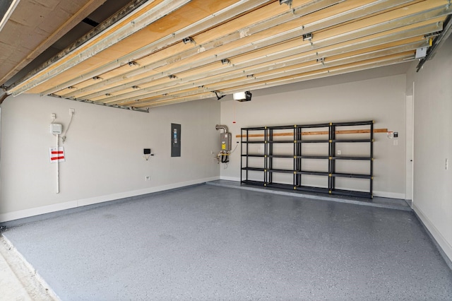 garage featuring electric panel, a garage door opener, and water heater