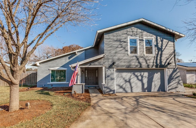 view of front facade with a front yard and a garage