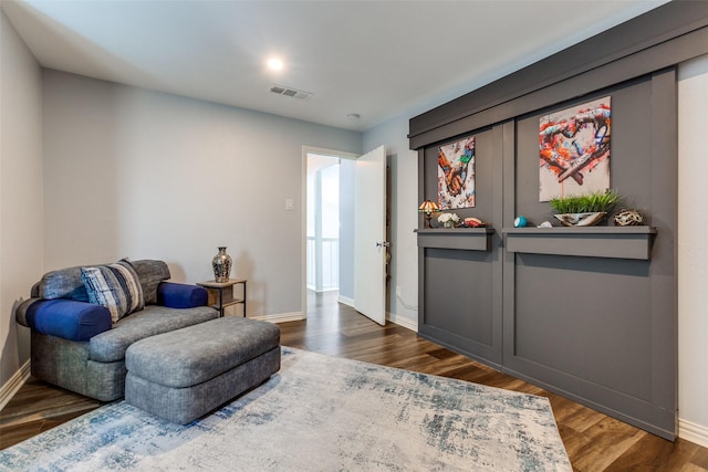 living area with dark hardwood / wood-style flooring