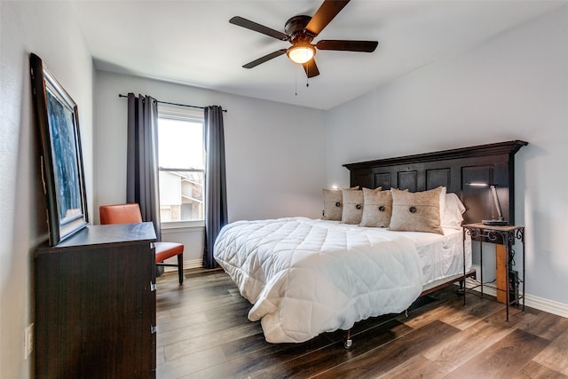 bedroom featuring ceiling fan and dark wood-type flooring