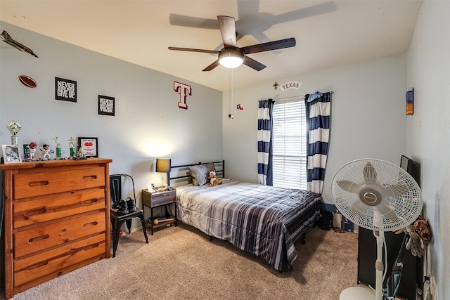 bedroom with ceiling fan and light carpet