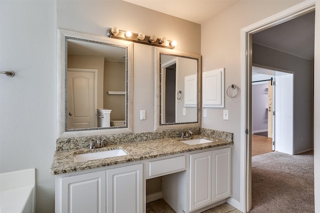 bathroom with double vanity and a sink