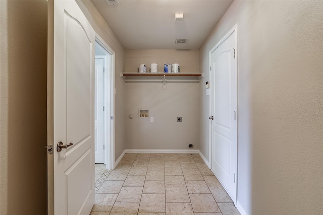 clothes washing area with washer hookup, visible vents, hookup for an electric dryer, laundry area, and baseboards