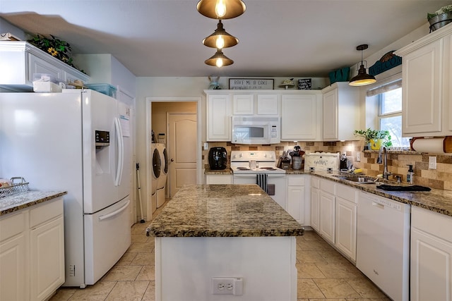 kitchen with white appliances, a kitchen island, sink, white cabinetry, and decorative light fixtures