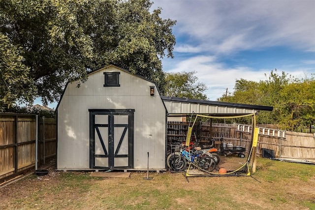 view of outbuilding with a yard