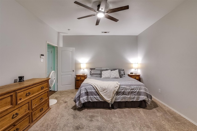 bedroom with light colored carpet and ceiling fan