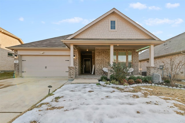 craftsman house with a porch and a garage