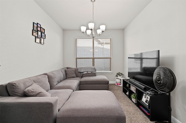 carpeted living room with a chandelier