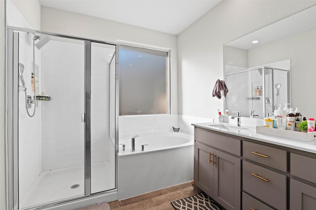 bathroom featuring vanity and plus walk in shower