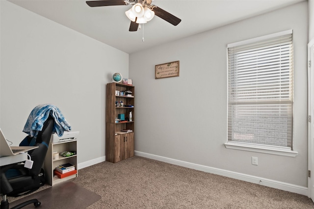 carpeted home office with ceiling fan