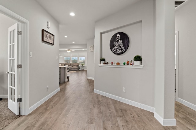 hallway featuring light hardwood / wood-style flooring