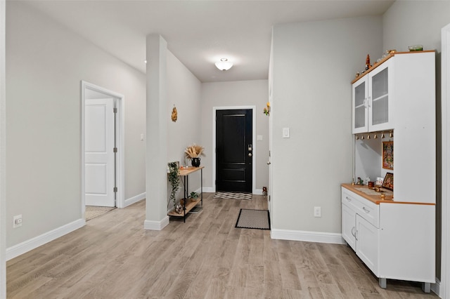 foyer entrance featuring light hardwood / wood-style flooring