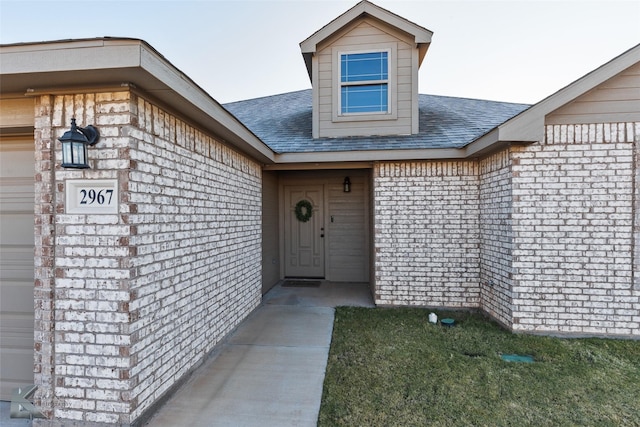 view of exterior entry featuring a garage