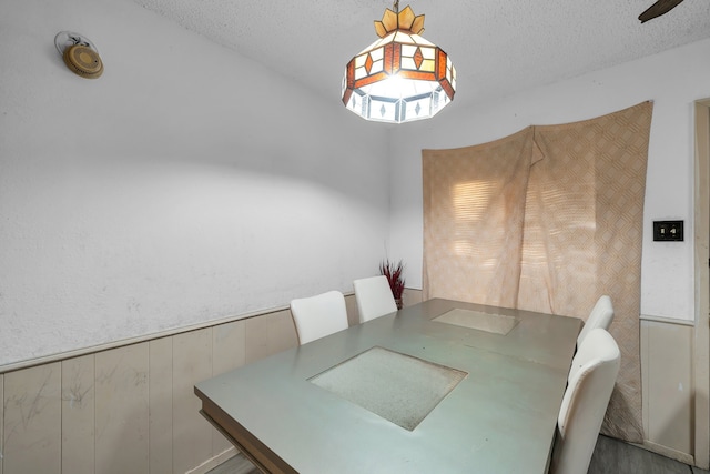 dining room with a textured ceiling