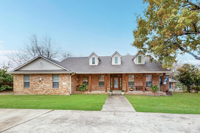 view of front of home with a front yard and a porch