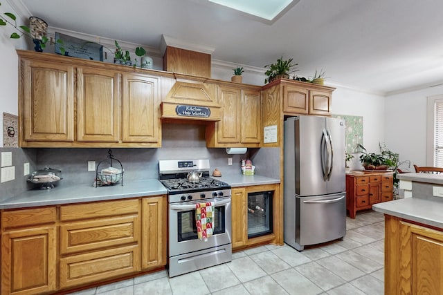 kitchen with appliances with stainless steel finishes, ornamental molding, custom exhaust hood, and decorative backsplash