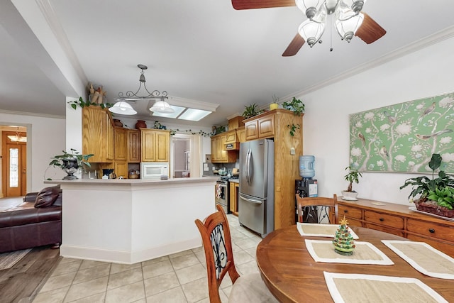 kitchen with stainless steel appliances, crown molding, ceiling fan, pendant lighting, and light tile patterned flooring