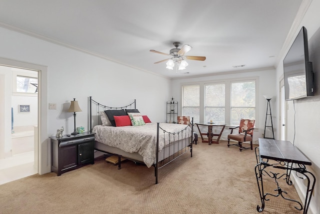 bedroom with ceiling fan, light colored carpet, multiple windows, and crown molding