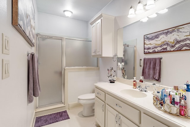 bathroom with toilet, a shower with door, and vanity