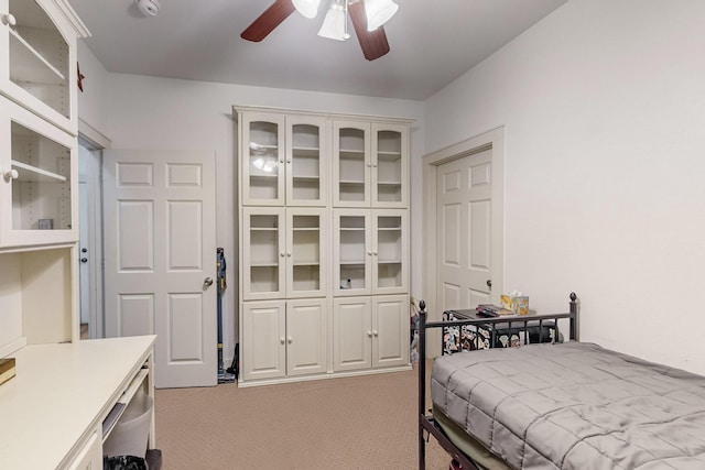 bedroom featuring ceiling fan and light colored carpet